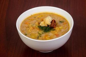 Peas soup with bread photo