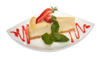 a piece of strawberry cheesecake on whit photo