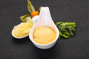 Cheese sauce in the bowl photo