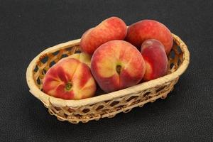 Sweet ripe tasty flat peach photo