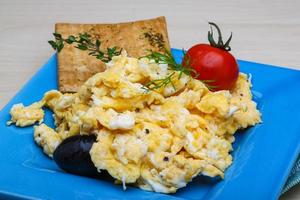 Scrambled eggs with tomato photo