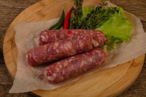 Raw pork sausages photo