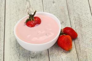 Yoghurt with strawberry in the bowl photo