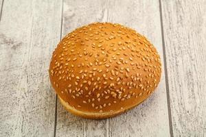 Burger bun with sesame seeds photo