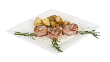 Grilled steak wrapped in bacon, with grilled vegetables, mashed potatoes photo