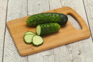 Ripe fresh green two cucumbers photo