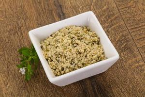 Peeled hemp seeds in the bowl photo