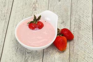 Yoghurt with strawberry in the bowl photo