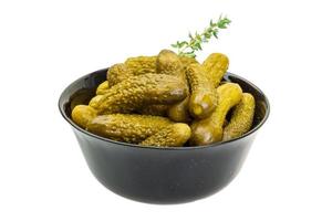 Marinated cucumbers, pickles in a bowl photo