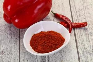 Paprika powder in the bowl photo