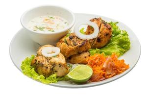 Chicken Tikka on white background photo