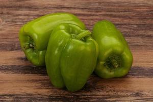 Three green bell juicy peppers photo