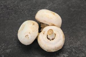 Raw Champignon heap for cooking photo