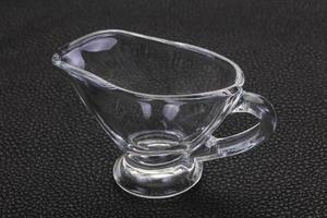 Empty glass gravy boat photo