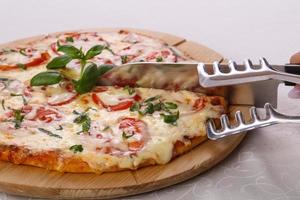 Pizza with tomato and cheese photo