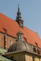 Cracow - Corpus Christi Church was founded by Kasimirus III The Great about 1340. The front elevation has a gothic gable whilst decoration of the interior is baroque photo