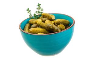 Marinated cucumbers, pickles in a bowl photo