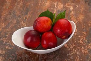 Sweet tasty ripe few nectarines photo