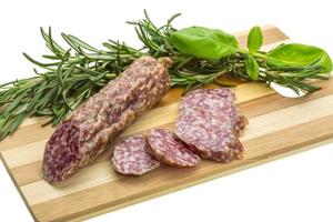 Salami with rosemary, basil photo