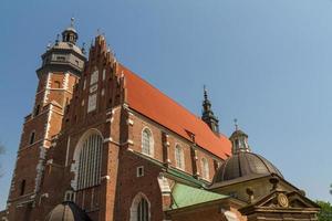 Cracow - Corpus Christi Church was founded by Kasimirus III The Great about 1340. The front elevation has a gothic gable whilst decoration of the interior is baroque photo