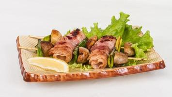 Bacon wrapped grilled Scallops with mushrooms and bacon photo