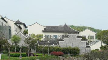 The beautiful Chinese countryside village view with  the old traditional buildings surrounded by the natural environment photo