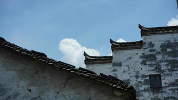 The beautiful Chinese countryside village view with  the old traditional buildings surrounded by the natural environment photo