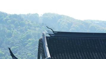 The beautiful Chinese countryside village view with  the old traditional buildings surrounded by the natural environment photo