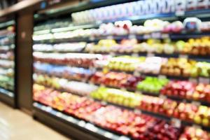 abstract blur organic fresh fruits and vegetable on grocery shelves in supermarket store defocused bokeh light background photo