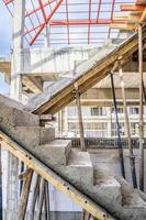 New house construction with concrete staircase at building site photo