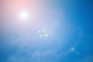 Airplane flying with blue sky photo