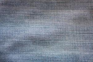 Texture of blue jeans textile close up photo