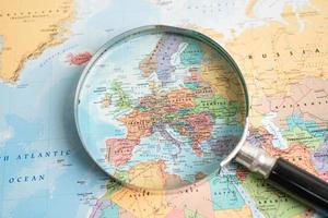 Bangkok, Thailand - May 01, 2022 China, Magnifying glass close up with colorful world map photo