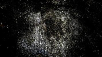 textura de pared oscura y aterradora para el fondo, la pared está llena de manchas y arañazos foto