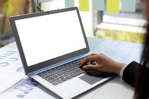 Person typing on laptop keyboard, on laptop screen blank white background for illustration, mockup screen for further editing can be used for a variety of tasks. copy space. photo