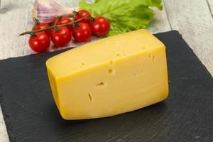 Hard yellow tasty cheese brick photo