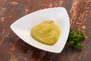 Mustard sauce in the bowl photo