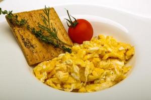 Scrambled eggs with tomato photo