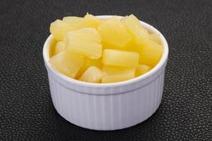 Marinated pineapple pieces photo