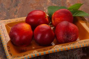 Sweet tasty ripe few nectarines photo