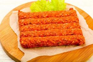 Raw beef sausages photo