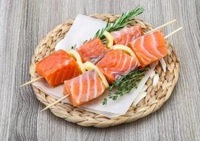 Raw salmon skewers photo