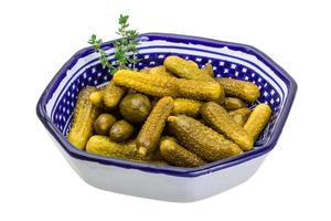 Marinated cucumbers, pickles in a bowl photo