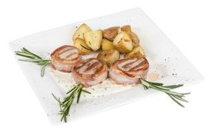 Grilled steak wrapped in bacon, with grilled vegetables, mashed potatoes photo