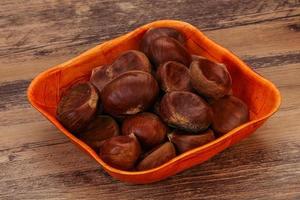 Chestnut heap in the bowl photo