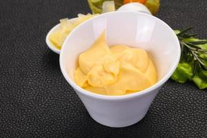 Cheese sauce in the bowl photo