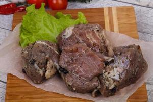 Marinated pork meat ready for coocking photo