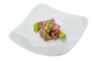 Beef carpaccio on white background photo