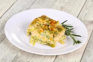 Tasty casserole with salmon and broccoli photo