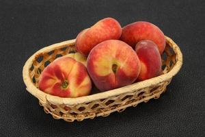 Sweet ripe tasty flat peach photo